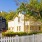 a white picket fence in front of a house