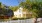 a white picket fence in front of a house