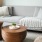 a couch with a table and potted plants